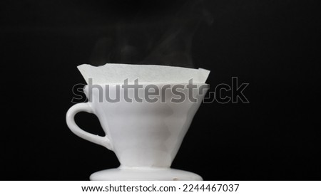 brewing coffee: brewing filter coffee hot water on black background