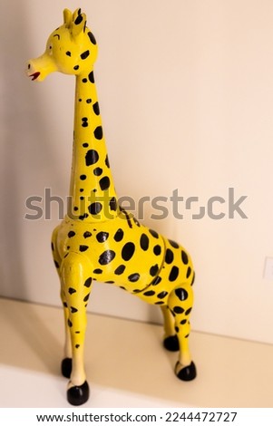 Close up of money box giraffe made between 1950 to 1970 from painted alder