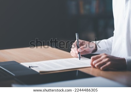 Businessman validates and manages business documents and agreements. , signing a business contract approval of contract documents confirmation or warranty certificate,employment idea, project review	