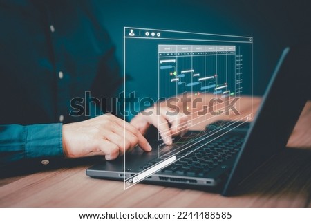 Man working with technology computer in Business Analytics and Data Management System to make report with KPI and metrics connected to database. Corporate strategy for operations, planing, marketing. Royalty-Free Stock Photo #2244488585
