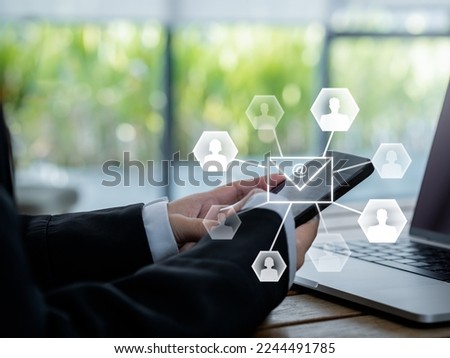 Sending Email and business marketing concepts. Digital letter with Email address symbol and person icons appearing while business person using mobile smart phone, list of clients for mailing.   Royalty-Free Stock Photo #2244491785