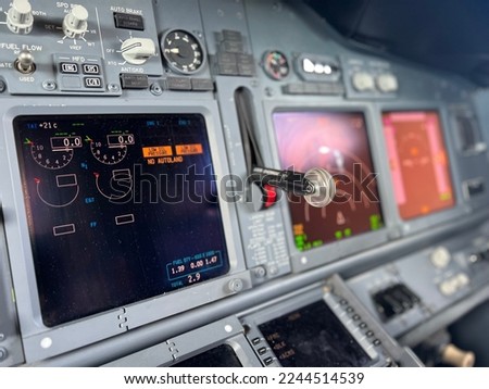 Plane Cockpit Boeing 737. Close Up Landing Gear And Screens Royalty-Free Stock Photo #2244514539
