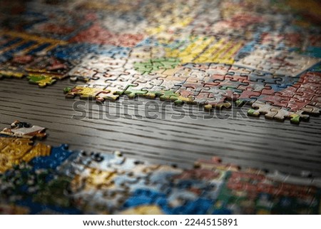 A puzzle on a table partially done 