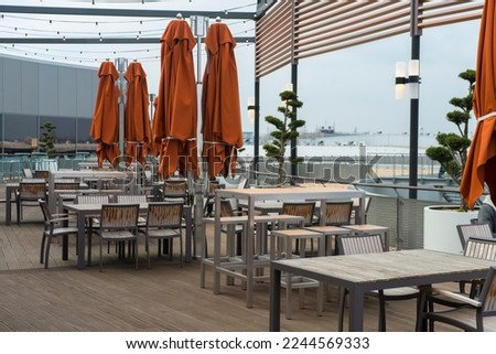 tables and chairs in an outdoor restaurant