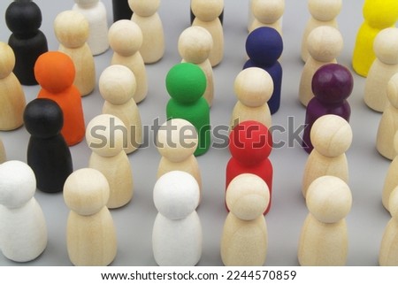 Crowd of different painted people figures on gray background. People talents, skills and individuality concept. Royalty-Free Stock Photo #2244570859