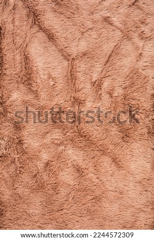 Brown fur background close-up vertical image.