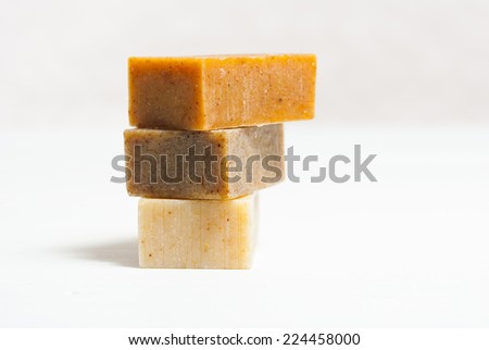 soap blocks on white wooden table, not isolated
