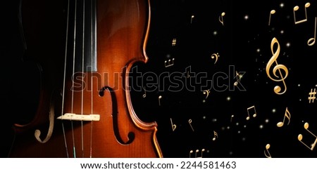 Violin, music notes and other musical symbols on black background, banner design Royalty-Free Stock Photo #2244581463