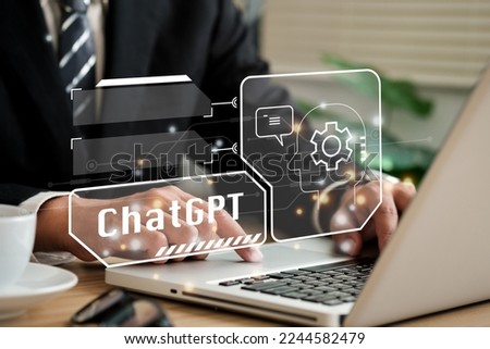ChatGPT Chat with AI or Artificial Intelligence. Young businessman chatting with a smart AI or artificial intelligence using an artificial intelligence chatbot developed by OpenAI.
 Royalty-Free Stock Photo #2244582479