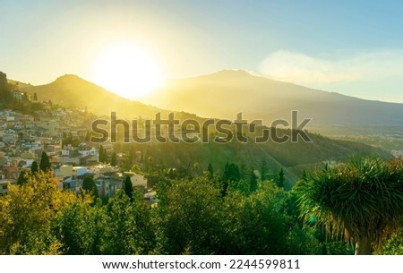 highland mediterranean travel landscape scenic picture from green garden to a beautiful mountain town in sunrise or sunset with  trees in garden and amazing colorful sky
