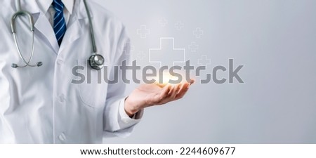 Doctor in white coat holding plus sign for positive healthcare insurance symbol concept, Mental health care, medical check up concept.