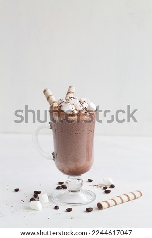 chocolate with whipped cream.Cup of Hot chocolate with marshmallow and wafer stick. Winter and autumn time. Christmas drink on the white background. copy space.