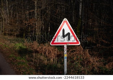 Succession of left turns. Road sign. Highway code sign. indication succession of bends, the first of which is on the left