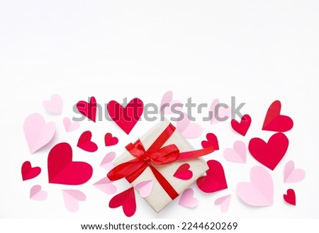 valentine's day composition mockup with pink and red paper hearts and gifts with red ribbon isolated on white background. top view. copy space. flat lay. February 14 concept