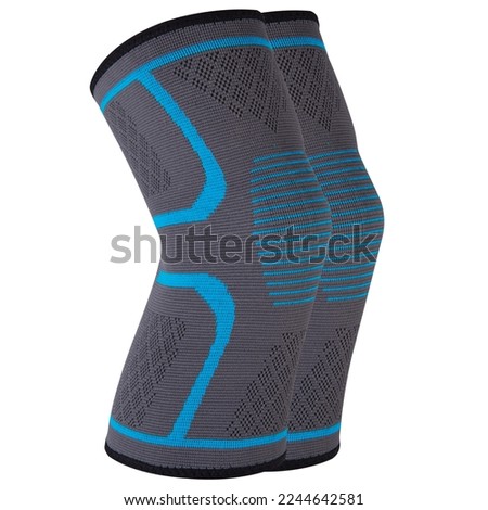 A pair of sports elastic knee pads with a blue pattern, for fixing and supporting the knee joints and ligaments, on a white background, isolate Royalty-Free Stock Photo #2244642581