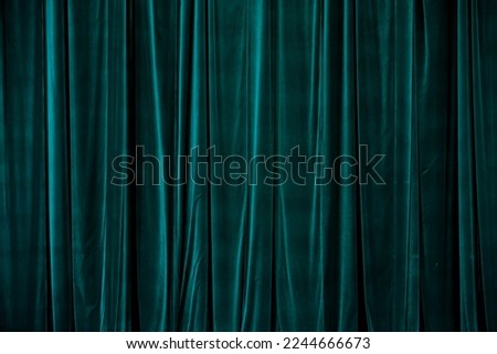 Teal curtain in theatre. Textured background Royalty-Free Stock Photo #2244666673