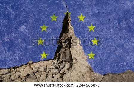 A mural graffiti of an EU flag crumpled in half. A concept of disintegration in the European Union. Royalty-Free Stock Photo #2244666897