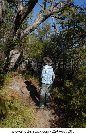 Woman on hiking trail from Picnic Bay to Hawkings Point, Magnetic Island, Queensland, Australia