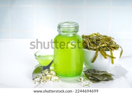 Algae based Oil, Seaweed alternative vegan oil, monounsaturated healthy fat ingredient with Algae Seaweeds Royalty-Free Stock Photo #2244694699