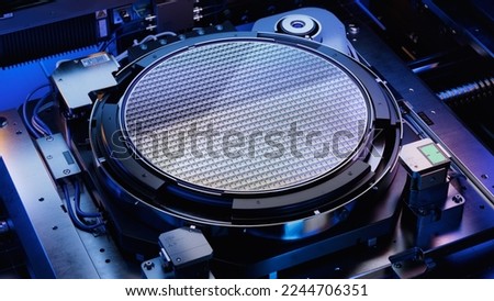 Top View of Silicon Wafer during Photolithography Process inside Complex Computer Chip Production Machine. Semiconductor Manufacturing at Fab or Foundry. Royalty-Free Stock Photo #2244706351