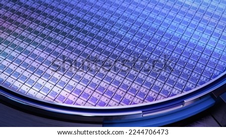 Macro Shot of a Silicon Wafer with Computer Chips during Manufacturing Process at Fab or Foundry. Semicondutor Wafer Texture. Royalty-Free Stock Photo #2244706473