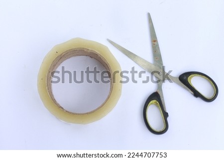 
scissors and duct tape on a white background. office tools