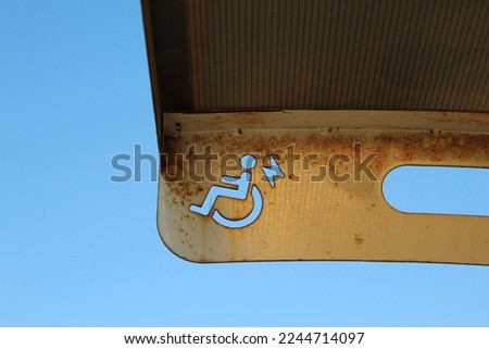 Handicapped sign with some rust. Electric car charge station. High quality photo
