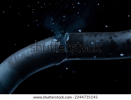 Old rubber hose straps,water or gas leak form rubber tube or hole Royalty-Free Stock Photo #2244735145