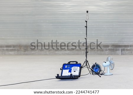 Complete air sampling device with pump, stand, thoracic selector head and fan, designed to count airborne asbestos fibres Royalty-Free Stock Photo #2244741477
