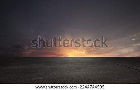 Dark Floor Background with Beautiful Sunset Cloud Night Sky Horizon Royalty-Free Stock Photo #2244744505