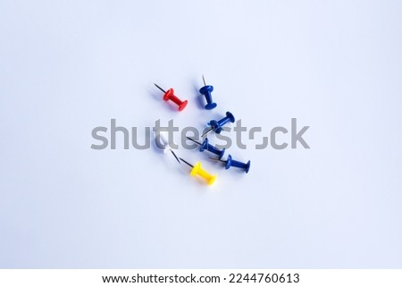 push pins for Notice Boards in Reusable red, blue, and yellow color isolated. white background.