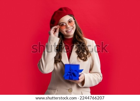 teen girl hold present in studio. holiday mood of teen girl holding present. photo of teen girl