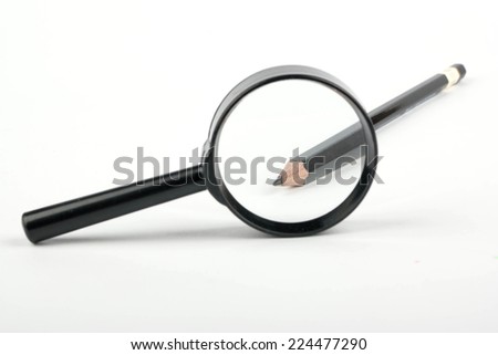 Sharpened end of a pencil into a magnifying glass