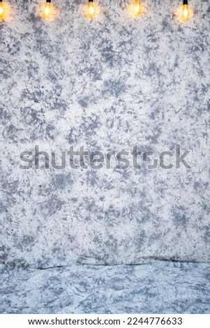 a light gray abstract design background with lights for a photo studio