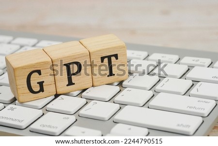 wooden cube with a GPT word written on computer keyboard. ChatGPT developed by OpenAI. ChatGPT illustration for banner, website, landing page, ads, flyer template.               Royalty-Free Stock Photo #2244790515