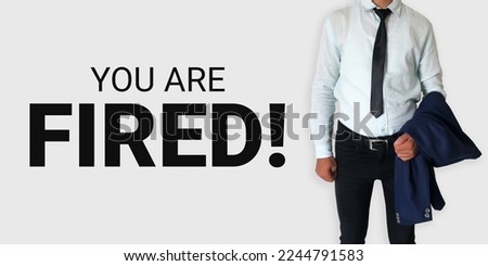 You are fired banner with a man holding his coat and typography on the side. Firing from job concept backdrop
