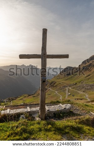 Klausenpass, Uri, Switzerland, October 29, 2022 Holy cross in an alpine scenery on a sunny day