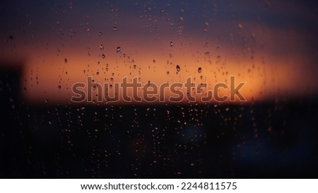 Sunset through a rainy window
