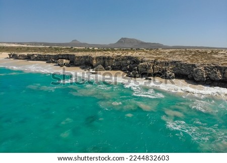 Coast of Boa Vista - paradise island next to the west coast of Africa. Nice waves and surf around the shore of Cape Verde island. Drone image of the Boa vista coast. Perfect sunny weather! Royalty-Free Stock Photo #2244832603
