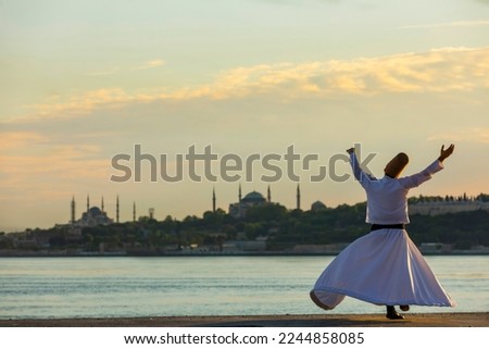Sufi Whirling Dervish in the Maidens Tower Beach, Uskudar  Istanbul, Turkey Royalty-Free Stock Photo #2244858085