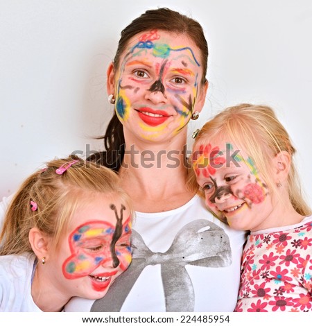 Happy family with face painting