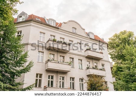 Residential Charm in Prenzlauer Berg, Berlin A Picture of a Typical Building Framed by Trees in the East