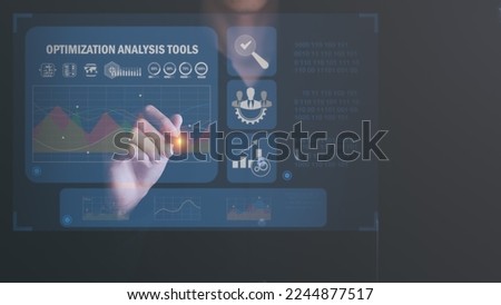 Marketer using pen pointing at graph and showing SEO concept, optimization analysis tools, search engine rankings, sites based on results analysis data,Using keywords to rank on search pages

