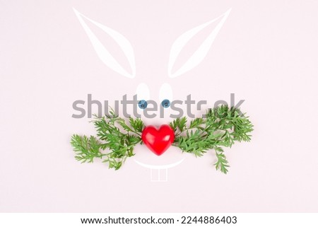 Easter bunny face, heart shaped nose , whiskers from carrot leaves, holiday greeting card, spring season 