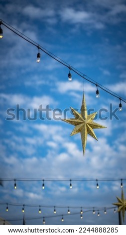 Christmas star light in the blue sky