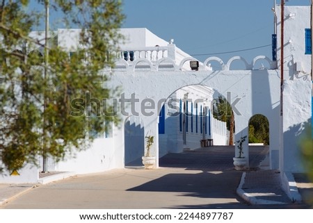 Synagogue El Ghriba.The oldest preserved synagogue in North Africa, built in the Moorish style, is located on the Tunisian island of Djerba, Royalty-Free Stock Photo #2244897787