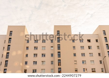 Captivating Photograph of a Monumental White Apartment Building with Numerous Homes