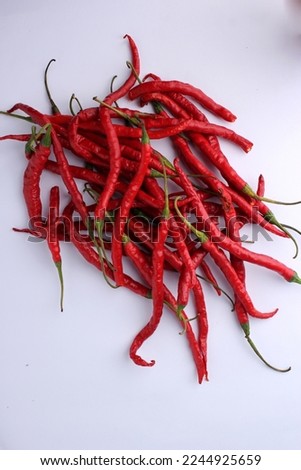 a pile of white-based red chilies in the photo in a flatlay position