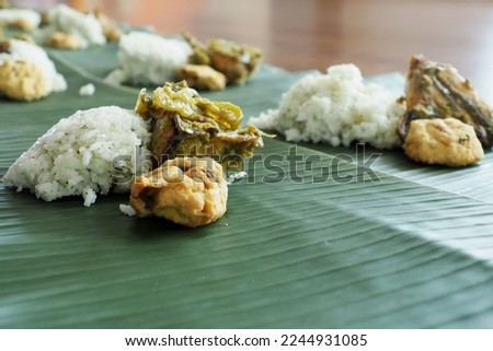 Nasi liwet is a typical Indonesian rice dish cooked with coconut milk, chicken broth and spices. Usualy cooked with coconut milk, chicken stock, bay leaves and lemongrass, giving the rice a rich