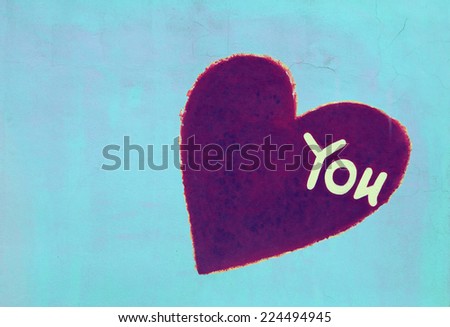 Vintage heart sign on grunge concrete wall ,valentine and love concept